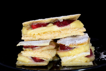 French Mille-feuille cake with fresh strawberry with isolated black background
