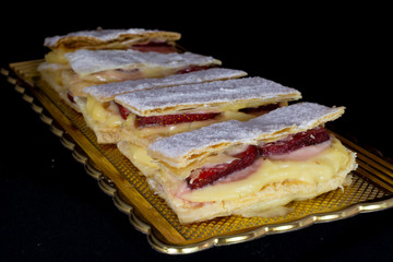 French Mille-feuille cake with fresh strawberry with isolated black background