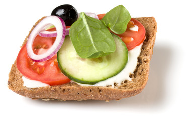Open faced sandwich crostini isolated on white background closeup. Vegetarian canape with tomato and cucumber. Appetizer tartarine.