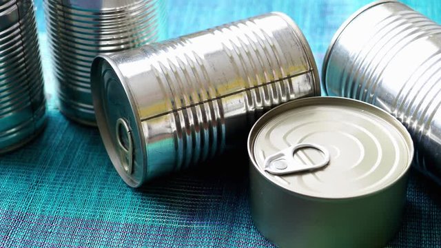 Tin cans with food. Conserved food. Closeup of a group of aluminium cans.