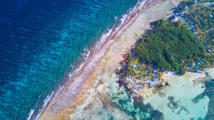 Aerial view of tropical island at Glover's Reef Atoll in Belize Barrier Reef