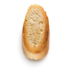Toasted baguette slice isolated on white background close up.  Toast, crouton.   Top view.