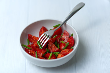 Tomato salad with green onions. Healthy food. Vegetarianism