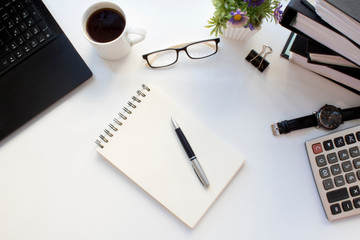 Business table with laptop and coffee. top view.