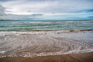 waves of the Atlantic Ocean rolling on the sand