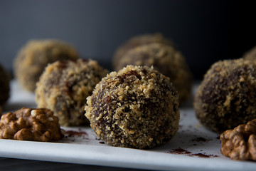 Energy healthy homemade truffles. Uncooked sweet balls made from walnuts and biscuits.