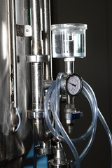 Equipment for malt fermentation in large tanks. Tanks for the brewery. The concept of the industry in the processing of malt.