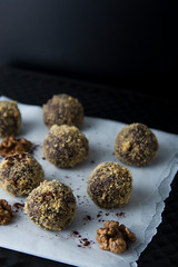 Energy healthy homemade truffles. Uncooked sweet balls made from walnuts and biscuits.