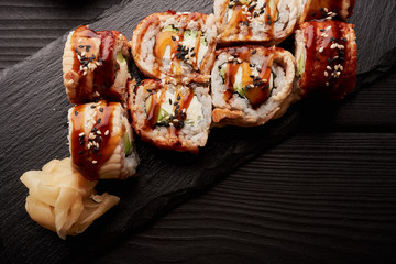 Canada roll with eel served with pickled ginger.