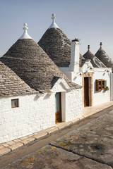 Fototapeta na wymiar shape of roofs of trulli houses in Alberobello in Puglia in Italy