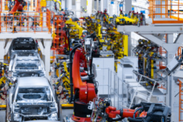 vague premise of Assembly line production of cars. Defocused image of car factory