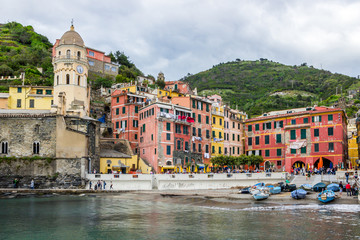 beach streets and colorful houses on the hill in Vernazza in Cinque Terre in Italy 