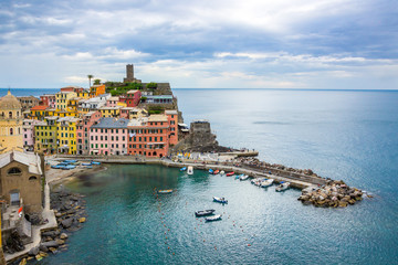 Fototapeta na wymiar beach streets and colorful houses on the hill in Vernazza in Cinque Terre in Italy 