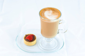 Cafe latte with small strawberry tart with isolated white background
