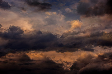 Obraz premium sunset sky with dark clouds close up - texture