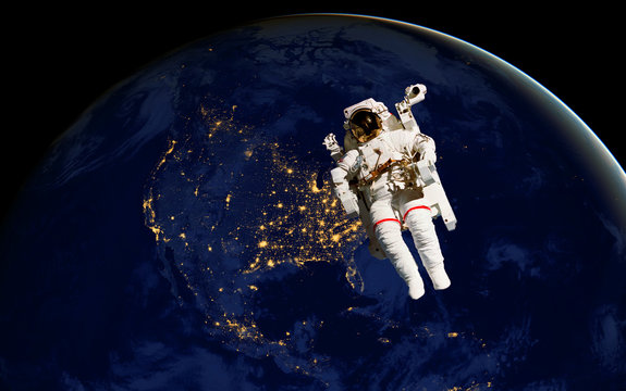 astronaut spacewalk at night from the dark side of the earth planet. Elements of this image furnished by NASA d