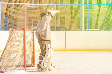 close up alone hockey goalkeeper protecting the gates during the match on the ice f