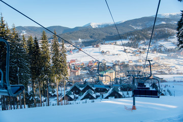 View from ski lift at winter ski resort in the mountains on a sunny morning nature calamity peace...