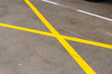 European road markings on the pavement in the parking lot after the rain