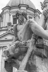 Statue of the god Zeus in famous fountain of the Four Rivers in Piazza Navona