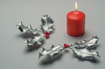 silver holly and red candle