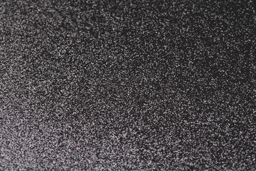 Black glitter texture for shiny christmas background.