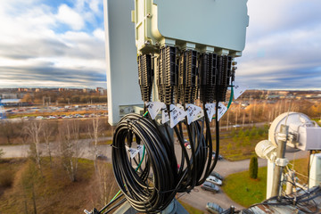 Panel antenna of GSM DCS UMTS LTE bands, GPS antenna and remote radio unit are as part of...