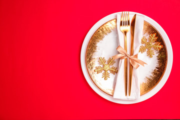 Christmas table setting conceptual design with fork, knife and festive attributes. New Year banquet serving appointment options with silverware. Background, close up, top view, flat lay, copy space.