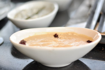 Traditional Cypriot meze and mix meat and chicken kebab table with charcoal barbecue on the table for self cooking during the eating time