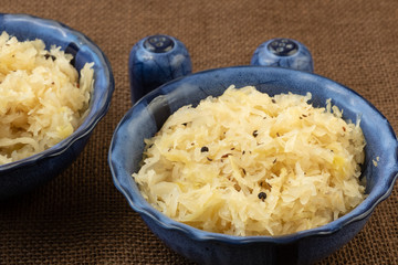 Sauerkraut in a blue bowl. Fresh healthy sauerkraut.