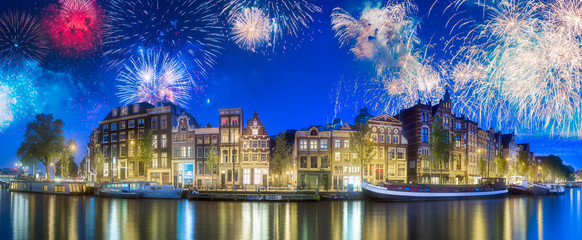 River, traditional old houses and boats, Amsterdam