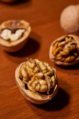 Walnut on brown wooden background. Selective focus
