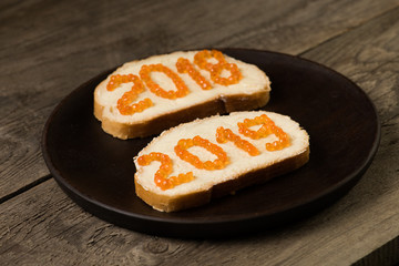 Sandwiches with red caviar 2018 and 2019 years text