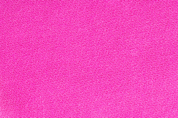 Pink fabric background texture. Detail of textile material close-up
