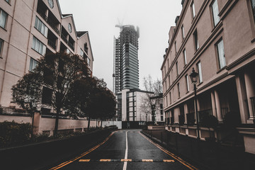 Skyscraper seen from an alleyway in London