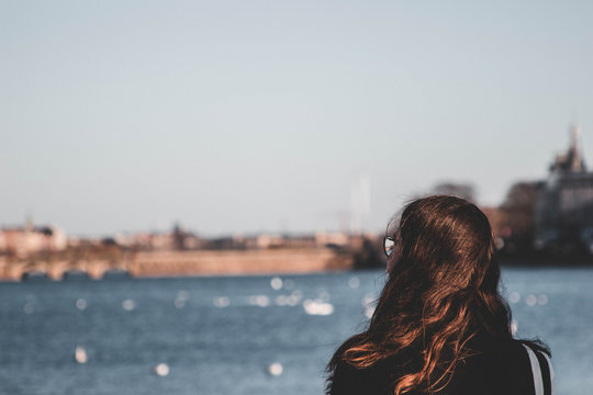 Woman looking out over the water