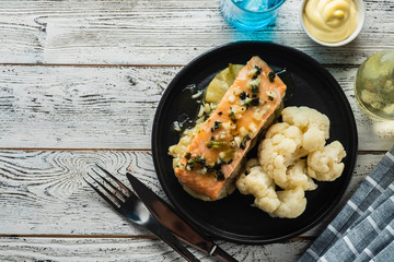Solomon fillet with pineapple and cauliflower. Fish with vegetables.