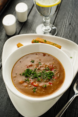 Goulash soup with beans, bell peppers and garlic croutons.