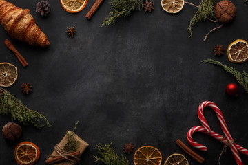 Christmas composition in rustic style on a black background. Top view. Copy space.