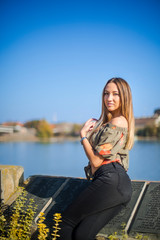Photographing a girl during autumn with a blurred background