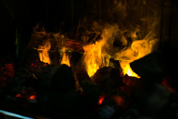 Artificial fire in a stone fireplace