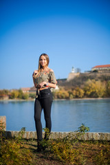 Photographing a girl during autumn with a blurred background