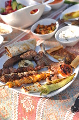 Traditional Cypriot meze and kebap barbecue party in the garden with delicious mix meat and chicken kebaps