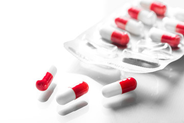 Pharmacy theme, white and red medicine tablets antibiotic pills.