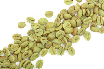 green coffee beans isolated on white background close up. Top view. Flat lay