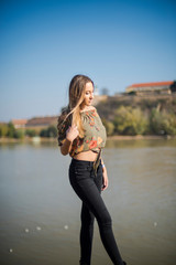 Photographing a girl during autumn with a blurred background