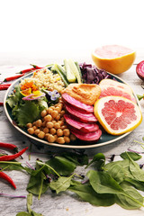 Bowl of Buddha, The concept of a healthy diet: chickpeas, salad, beetroot, pumpkin, cucumber, grapefruit, cabbage and tabouleh. Balanced food.