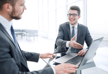 Fototapeta premium close up.business partners discuss information sitting at the office table