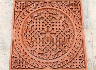 Traditional tufa stone carving ornament on a wall of Armenian Orthodox Church
