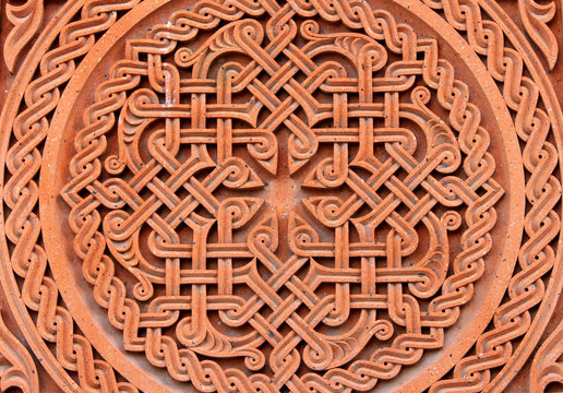 Traditional tufa stone carving ornament on a wall of Armenian Orthodox Church